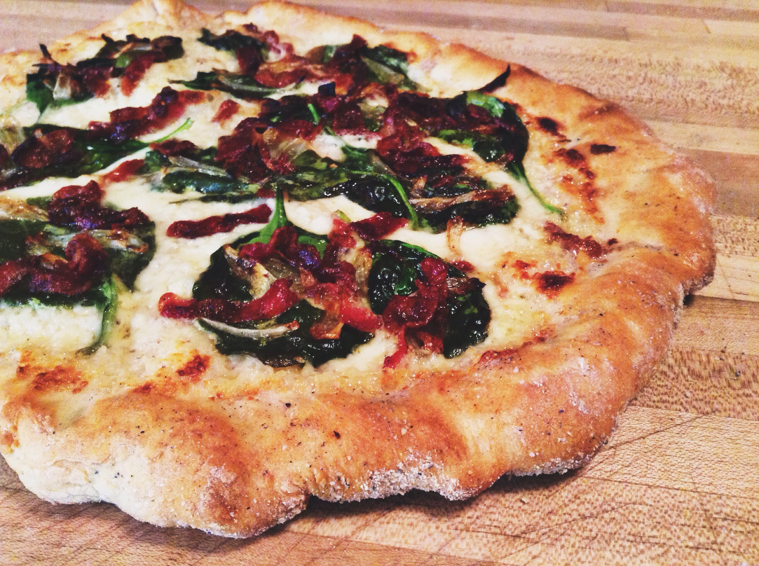 Travel Limbo Calls for Spinach & Bacon Alfredo Pizza