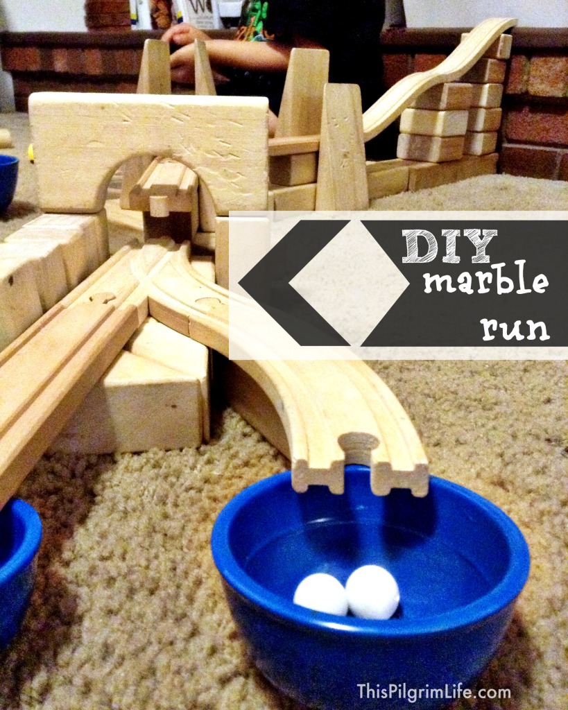 Make a marble run with wooden train tracks and blocks!