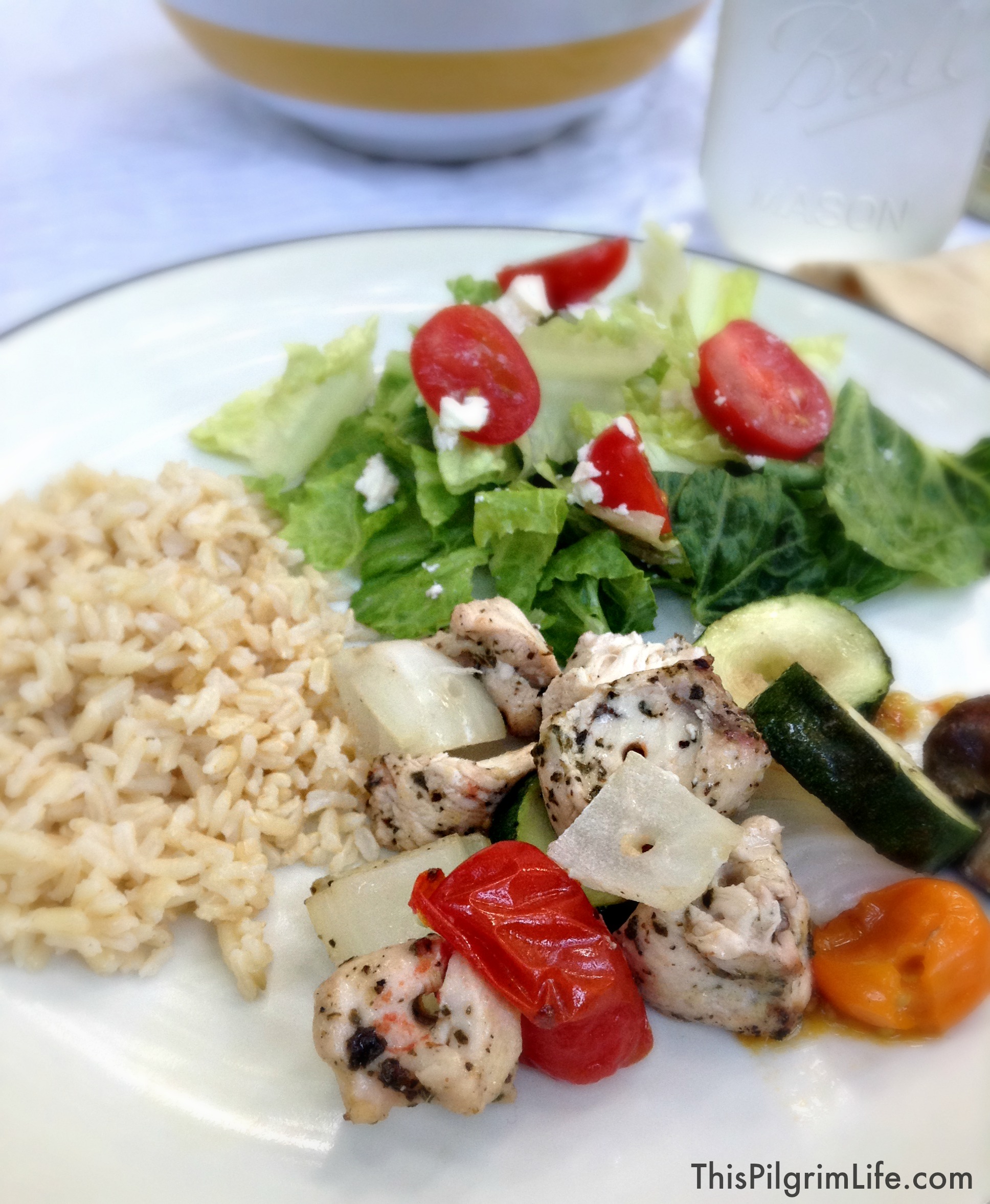 Copycat Zoe's Kitchen- An easy, at-home version of Zoe's grilled chicken kabobs, rice, and Greek salad. 