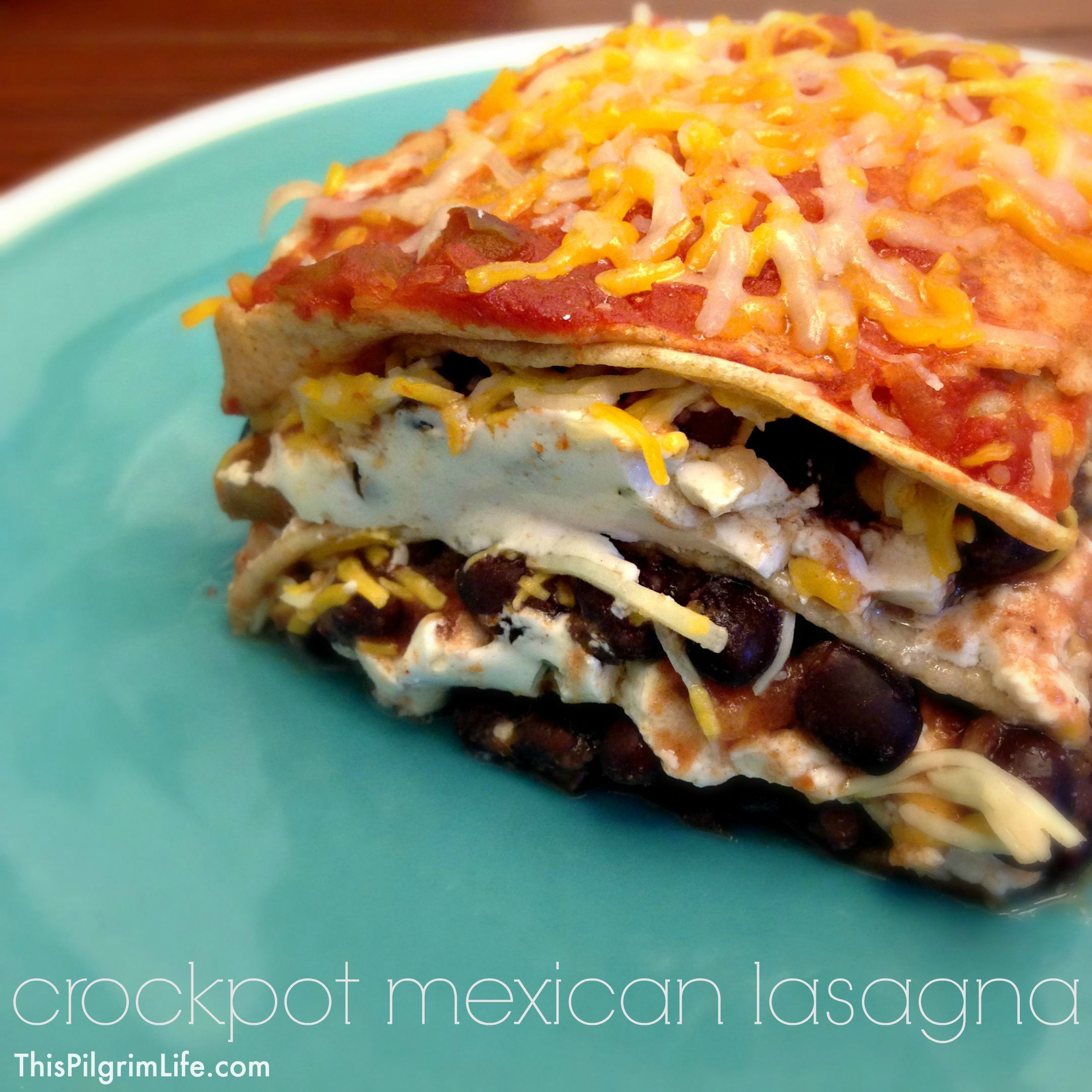 Such a simple and delicious recipe for Mexican lasagna made in the crockpot. Perfect for potlucks and sharing with friends!