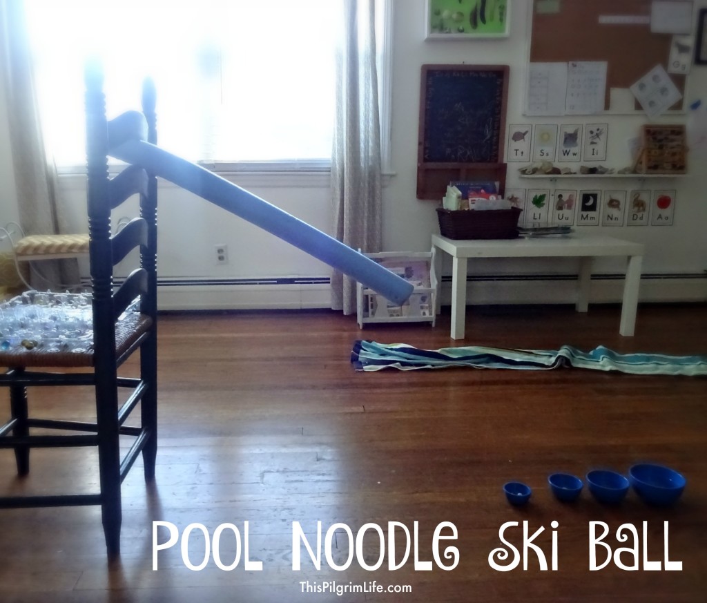 Make a fun ski ball game using a pool noodle, marbles, and a few small bowls!