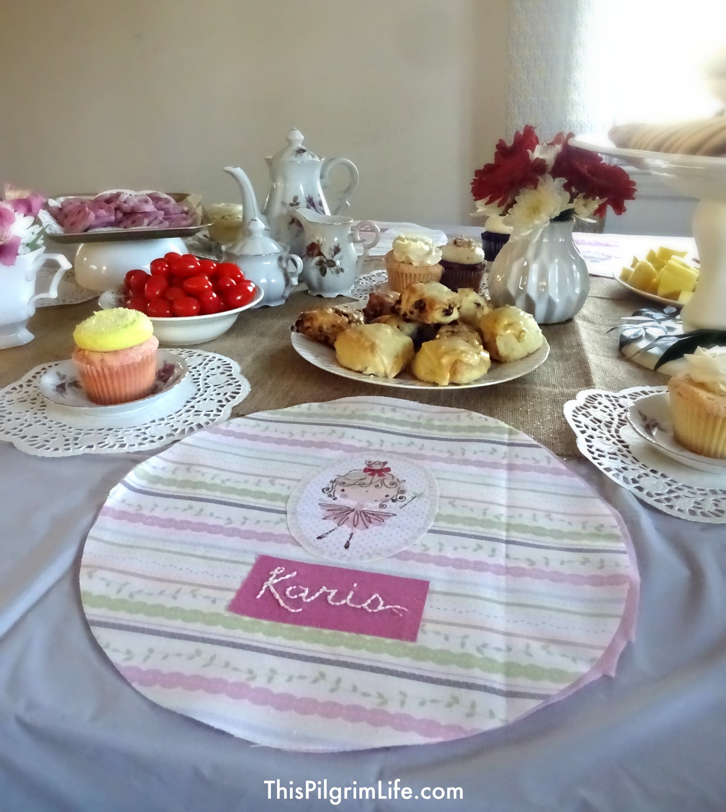 My little girl turned two this week and we celebrated with a very simple tea party. With items from the Dollar Store and Goodwill, I put together a pretty, yet inexpensive, party with a handful of her friends. 