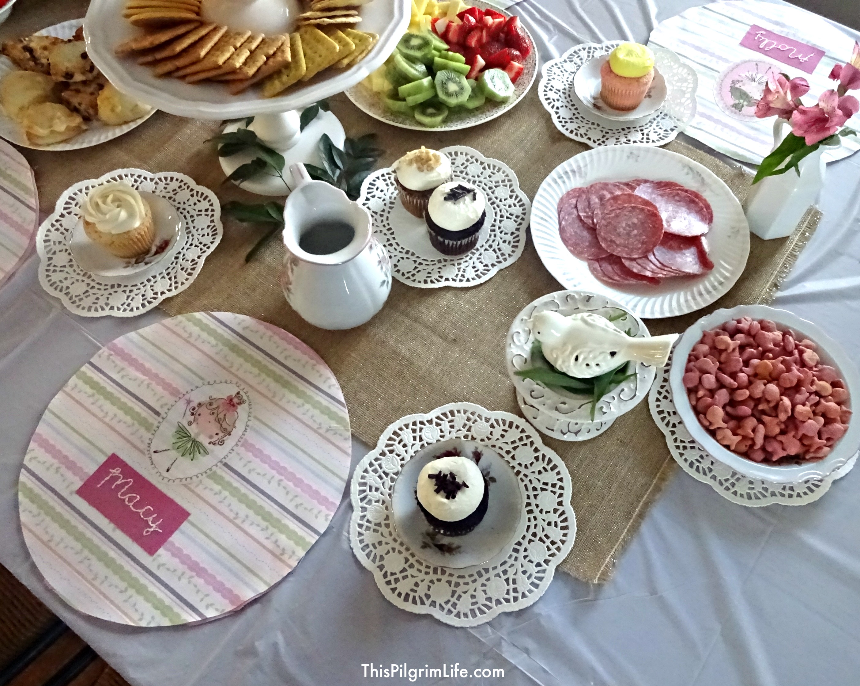 My little girl turned two this week and we celebrated with a very simple tea party. With items from the Dollar Store and Goodwill, I put together a pretty, yet inexpensive, party with a handful of her friends. 