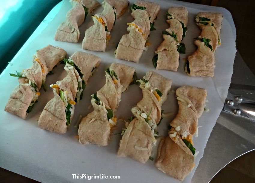 A quick pizza dough becomes a delicious and simple meal idea when rolled out and stuffed with cheese and spinach! 