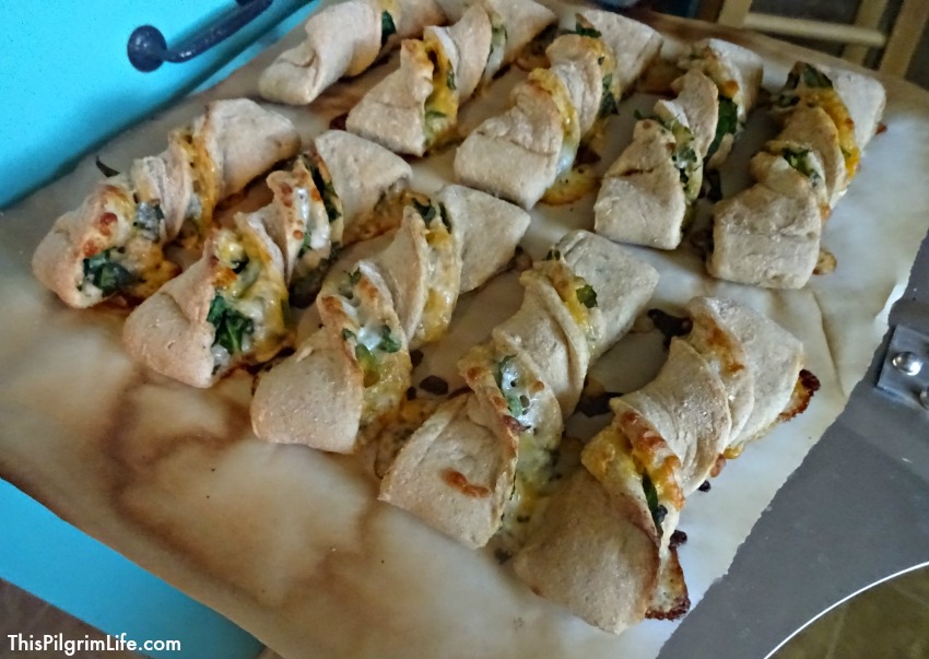 A quick pizza dough becomes a delicious and simple meal idea when rolled out and stuffed with cheese and spinach! 