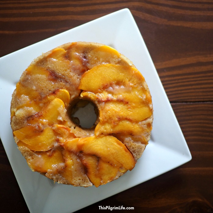 This upside down peach cake is AMAZING! Naturally sweetened, no oils or butter, and made in the pressure cooker to give it extra richness and moistness. 