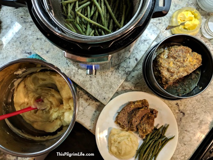 Our family loves this meal, and I love how easy it is to make all together in the Instant Pot! Instant Pot meatloaf, mashed potatoes, and dilly green beans make such a quick and easy family meal! 