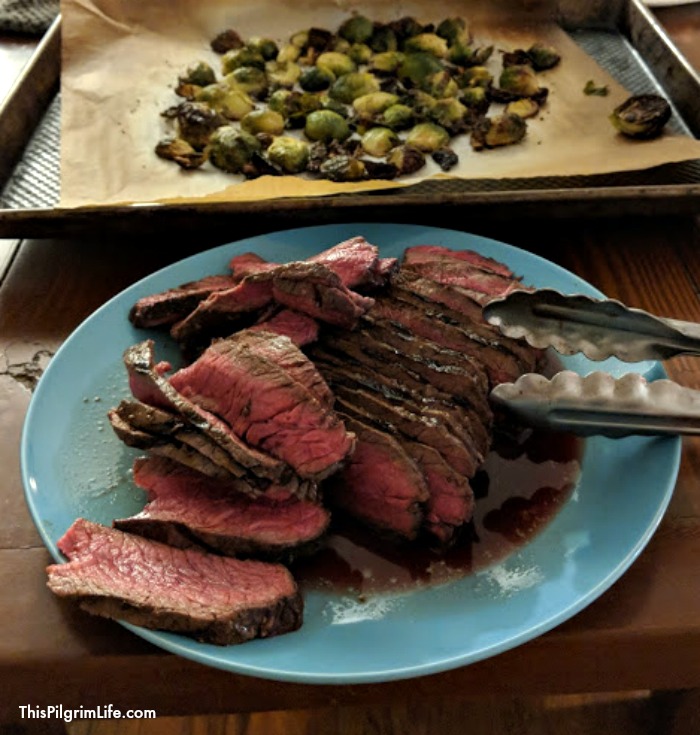 Cook a London broil on a cast iron griddle for an amazing and budget-friendly steak dinner at home! Easy enough for a weeknight meal, delicious enough for a dinner with friends! 