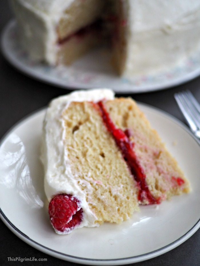 This white chocolate raspberry cake is decadent without being overwhelming. The frosting is light and subtly sweet. The cake is perfect AND gluten-free (no one will ever know). And the layer of sweet raspberry jam ties everything all together with a little red bow. 