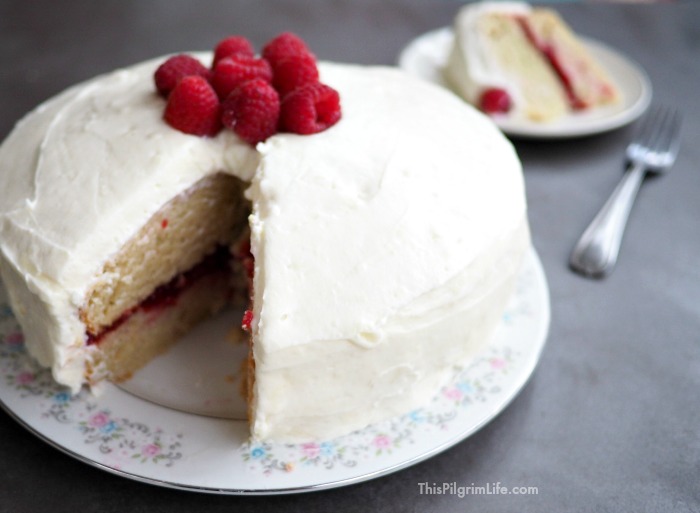 This white chocolate raspberry cake is decadent without being overwhelming. The frosting is light and subtly sweet. The cake is perfect AND gluten-free (no one will ever know). And the layer of sweet raspberry jam ties everything all together with a little red bow. 