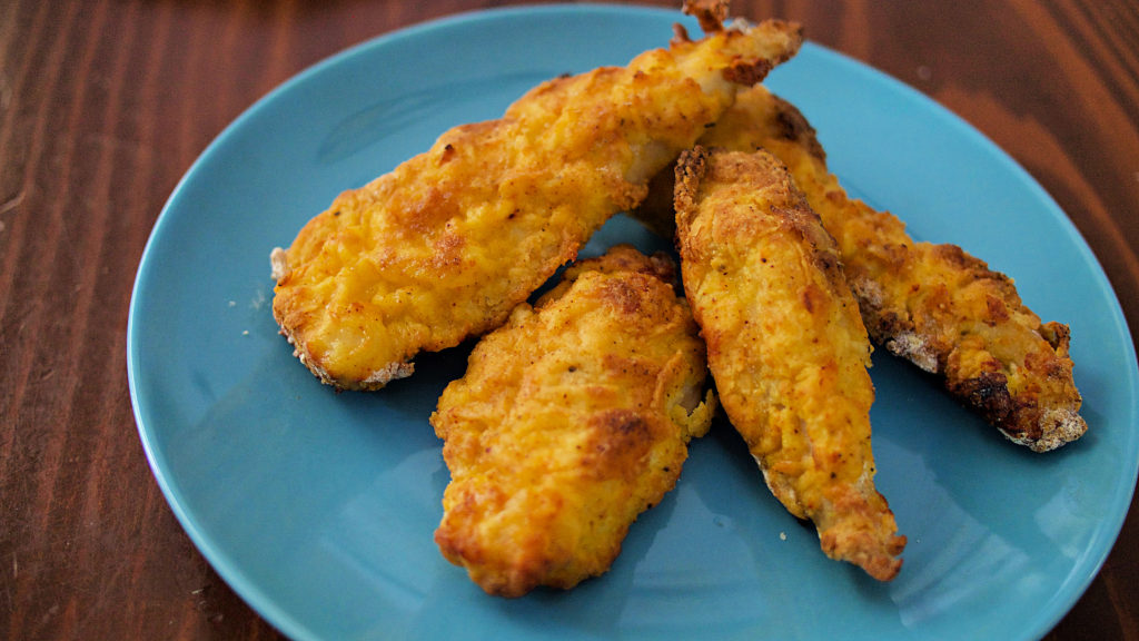 Fried chicken tenders made in the Mealthy CrispLid